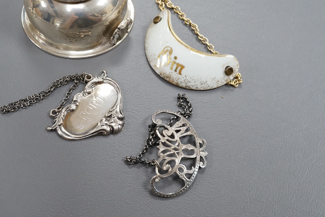 A modern silver wine funnel, with shell thumbpiece, L.J. Millington, Birmingham, 2000, 13.4cm, together with a small silver pedestal cup, three assorted sterling wine labels and three other wine labels including two plat